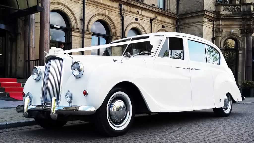 Austin Princess with wedding ribbons on the bonnet