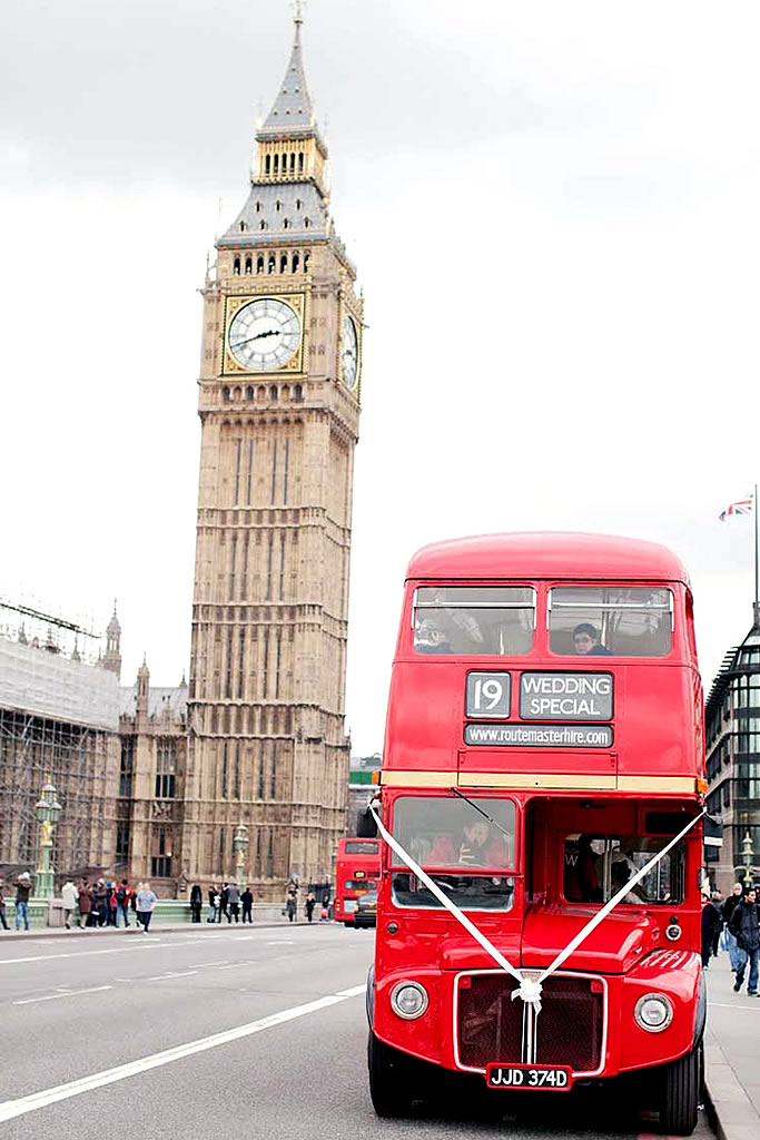 London Wedding Bus on hire with Big Ben in background on London Bridge